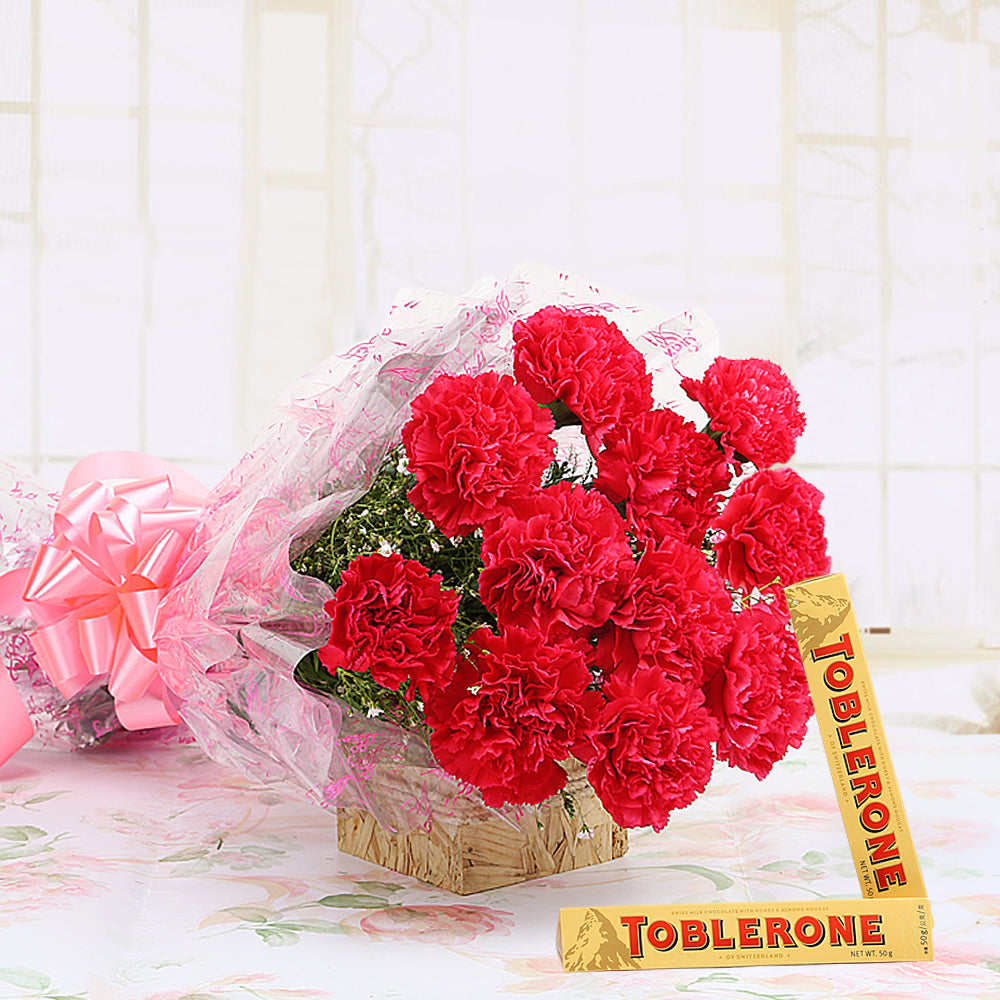 Bouquet of red carnations with toblerone chocolates - for birthday anniversary valentine congratulations good-luck - free urgent delivery India - Delhi Mumbai Bangalore Pune Hyderabad Chennai Kolkata Ahmedabad