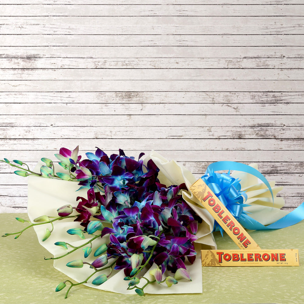 Bouquet of blue orchids in luxury wrapping with chocolates - for birthday anniversary valentine congratulations good-luck - free urgent delivery India - Delhi Mumbai Bangalore Pune Hyderabad Chennai Kolkata Ahmedabad