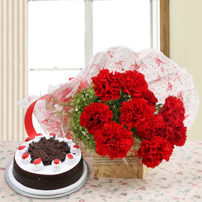 Bouquet of red carnations with black forest cake - for birthday anniversary valentine congratulations good-luck - free urgent delivery India - Delhi Mumbai Bangalore Pune Hyderabad Chennai Kolkata Ahmedabad
