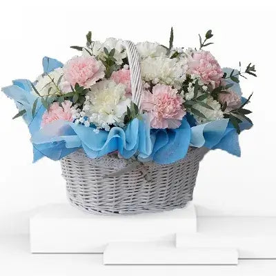 Delightful Basket Arrangement of Pastel Pink and White Carnations