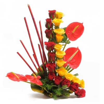 Basket of 22 yellow and red roses flowers with 4 anthuriums - for birthday anniversary valentine congratulations good-luck - free urgent delivery India - Delhi Mumbai Bangalore Pune Hyderabad Chennai Kolkata Ahmedabad