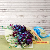 Bouquet of blue orchids in luxury wrapping with chocolates - for birthday anniversary valentine congratulations good-luck - free urgent delivery India - Delhi Mumbai Bangalore Pune Hyderabad Chennai Kolkata Ahmedabad