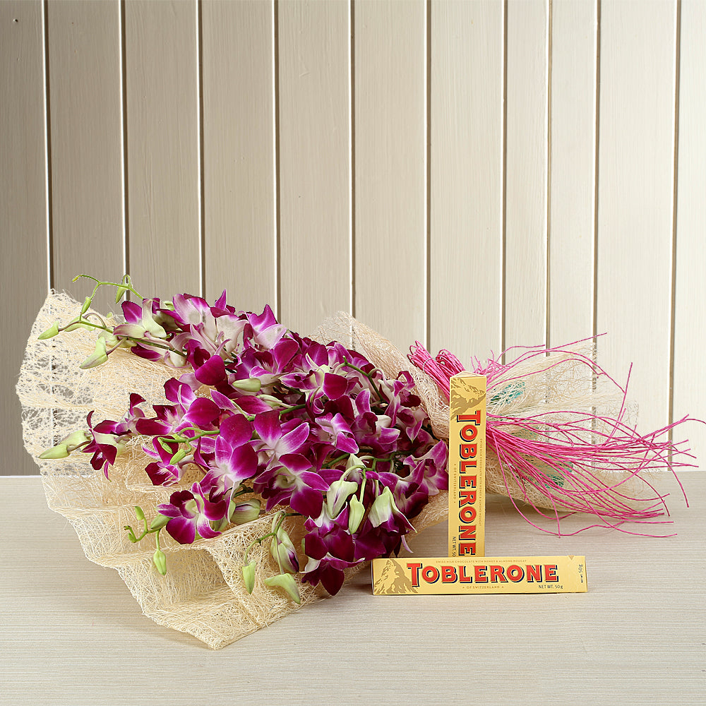 Bouquet of Purple Orchid with Toblerone Chocolates - for online delivery for your love - birthday anniversary congratulations good-luck - free urgent delivery India - Delhi Mumbai Bangalore Pune Hyderabad Chennai Kolkata Ahmedabad NOIDA Gurugram